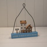 Wooden Hanging Blue Double House ‘A Home is Made of Love & Dreams’ Sign with neutral Houses and Arrow